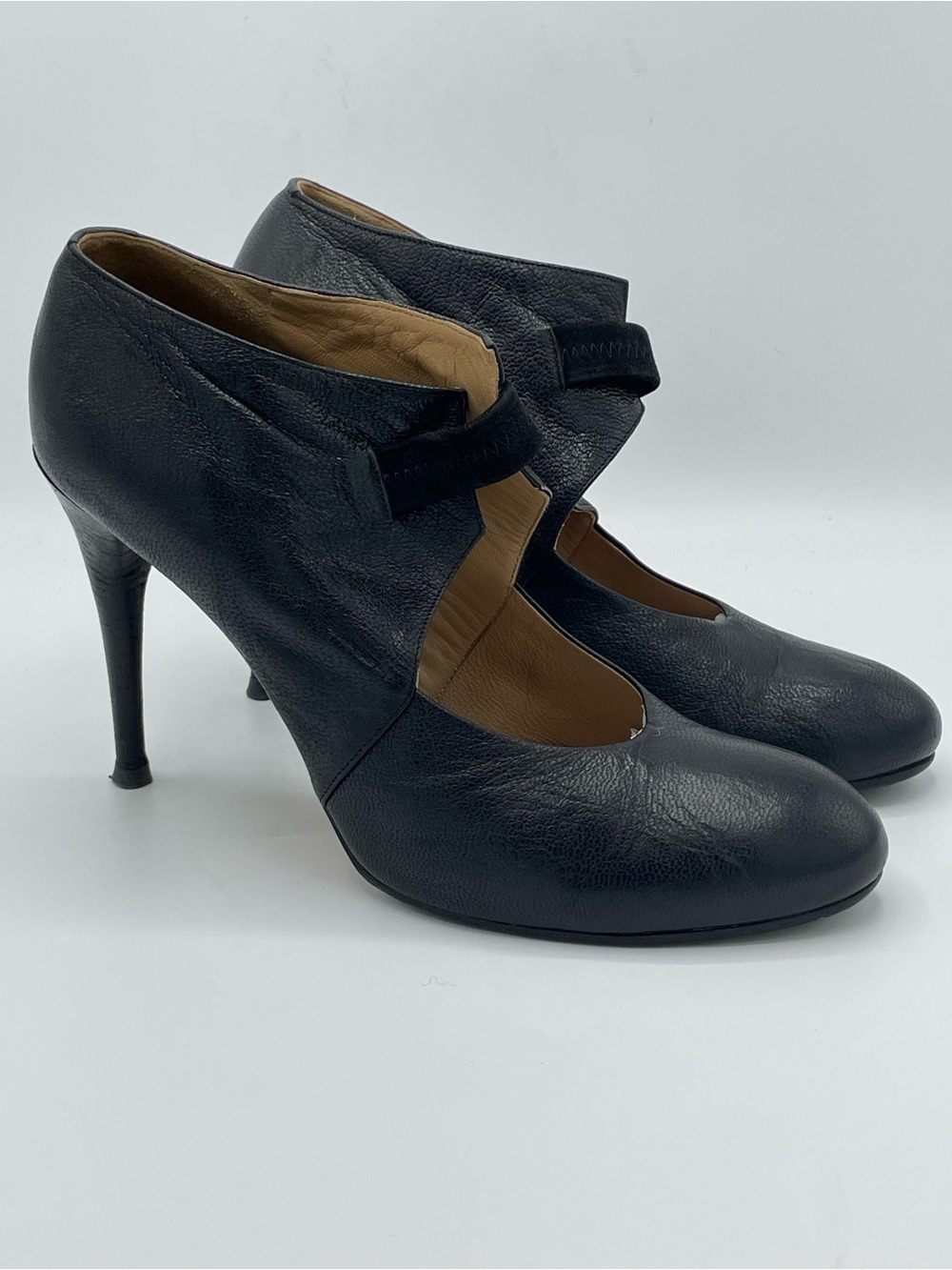 Chole Black Leather Slim Stiletto Heel Pumps with Elastic Strap Across Top.